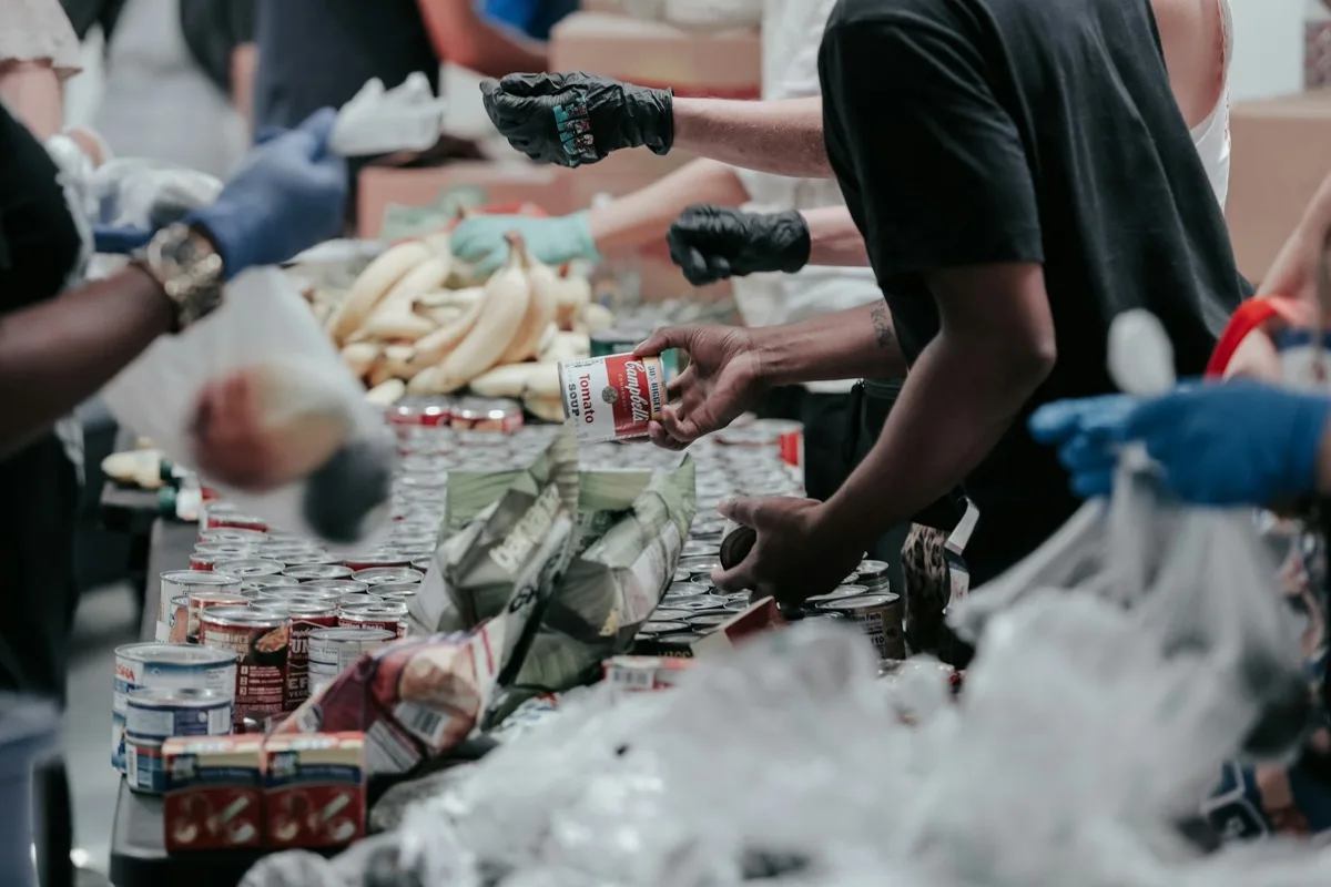 Volunteers sorting food donations at a community event